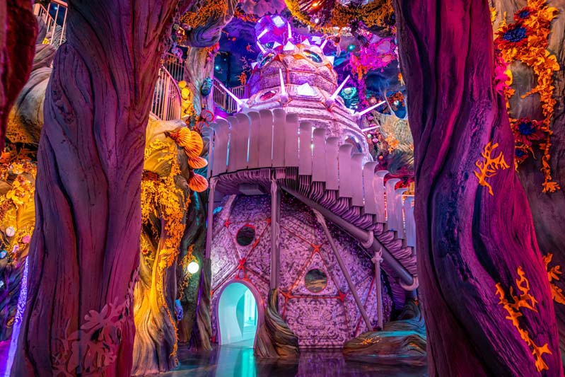 large snowman-shaped building from another world inside a sentient swamp-like space at Meow Wolf Denver