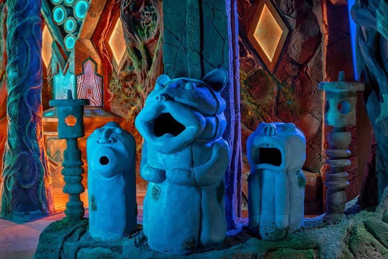 small sculpture creatures with mouths open like they are singing