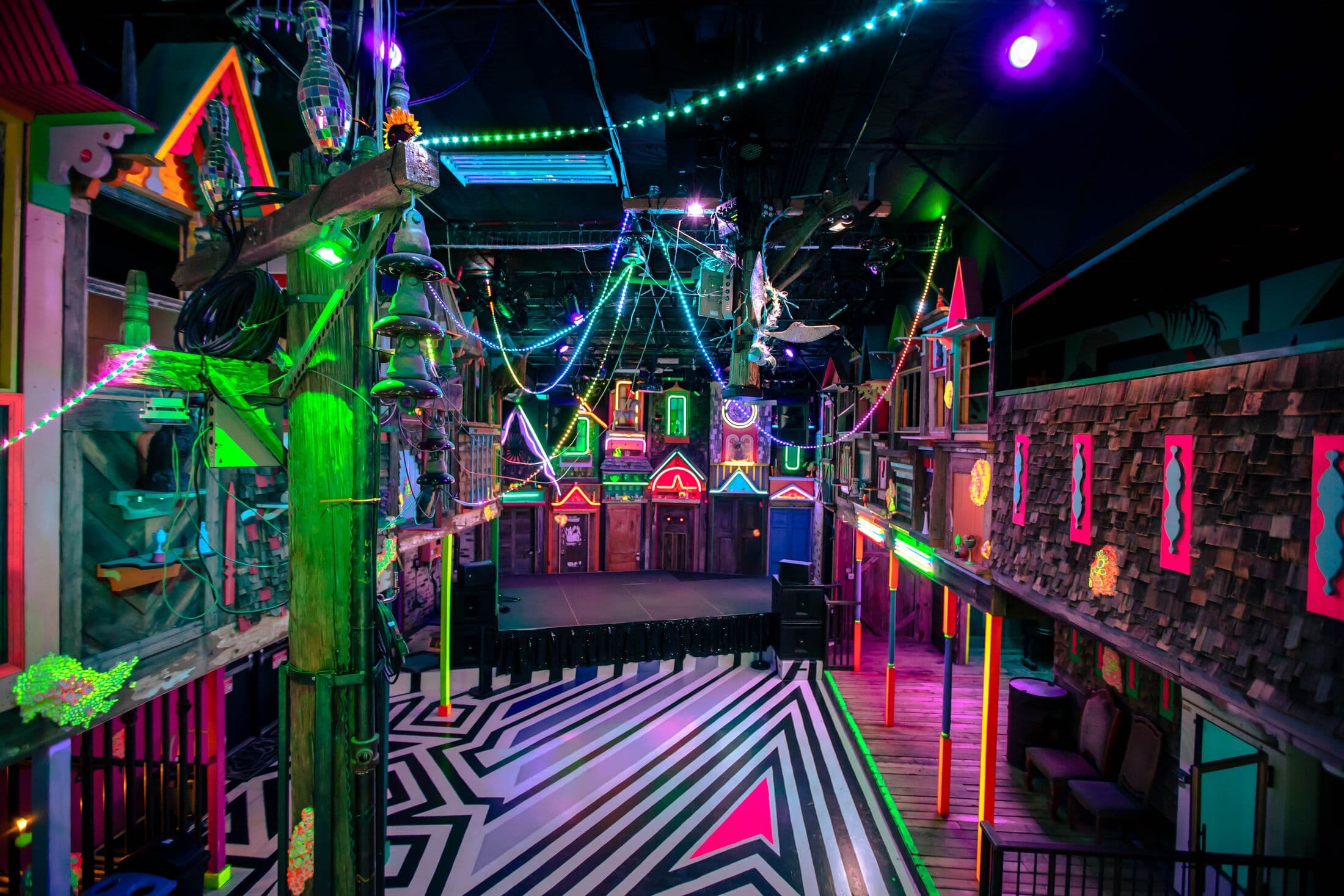 neon houses in a music venue space in Santa Fe