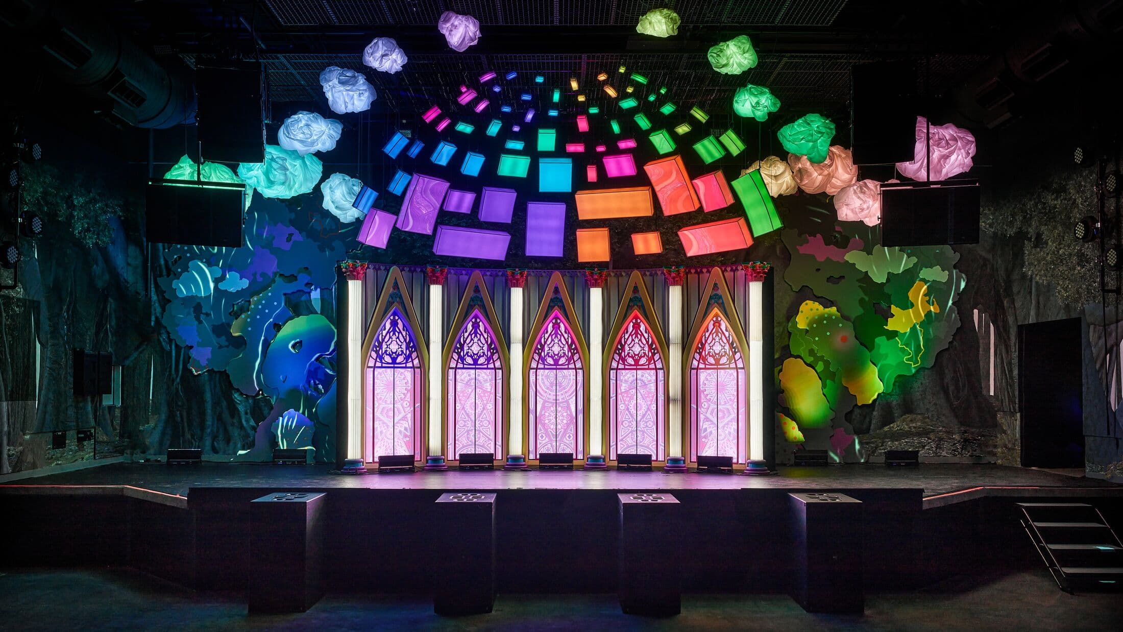 stage in Meow Wolf Denver with bright lights