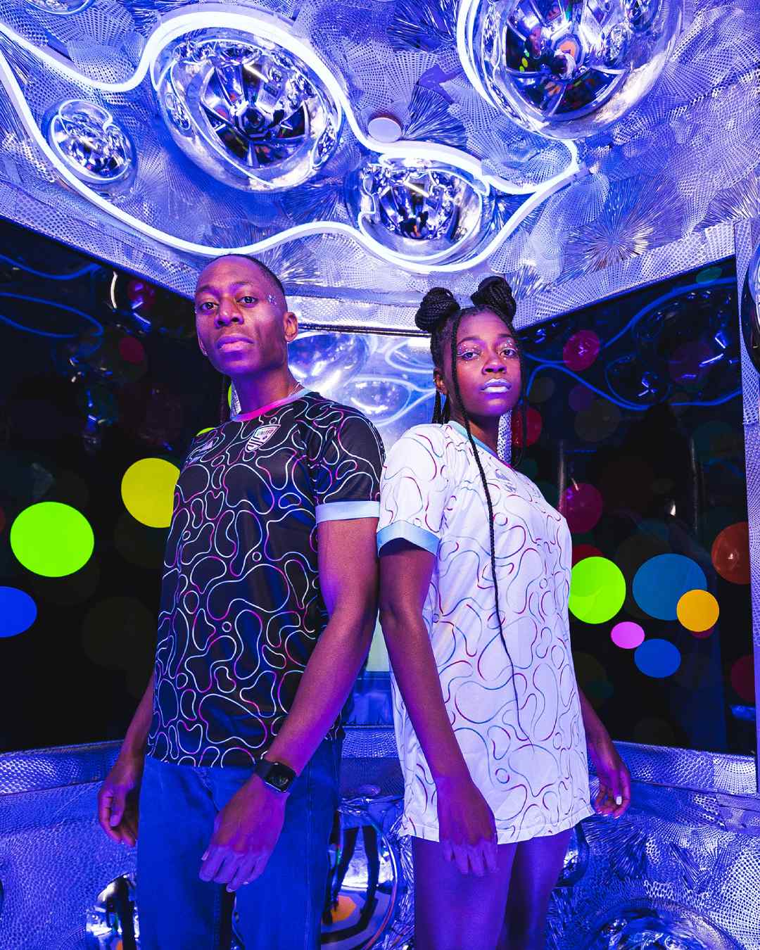 Two models wear the United Jersey titled, “Portals” by designer Caleb Ortega.