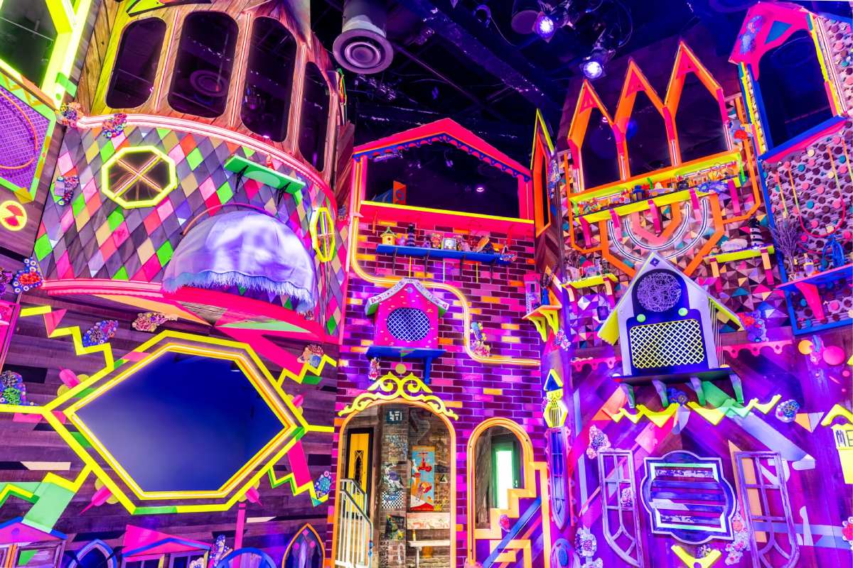 A colorful building with neon tiling and walls.