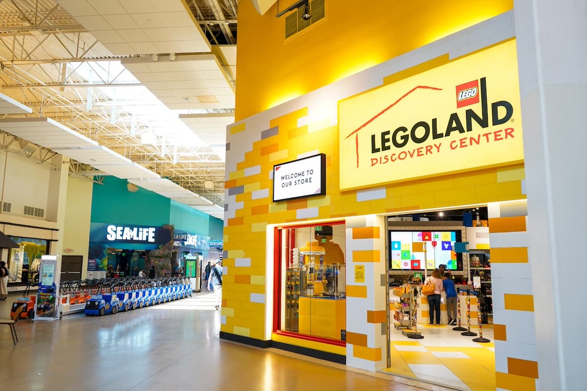 A Legoland Discovery Center mall entrance caddy corner from the SeaLife Aquarium storefront