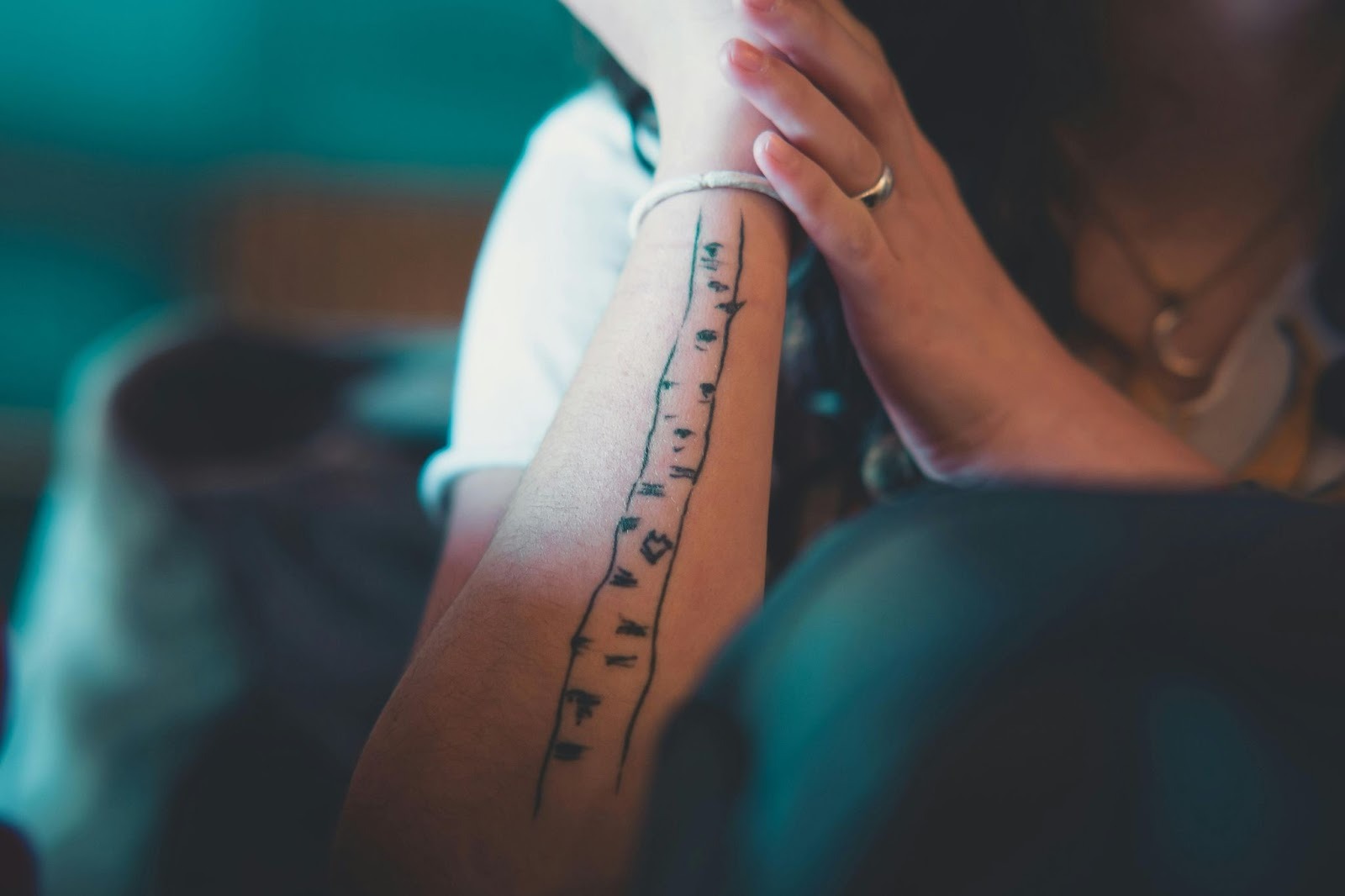 A minimalist tattoo that uses negative space to depict an image