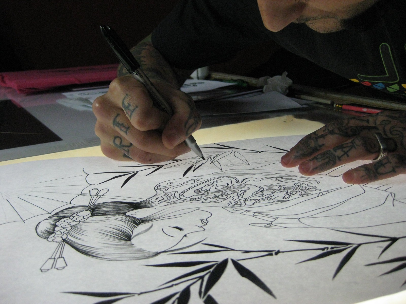 A tattoo artist drawing a sketch in Irezumi style