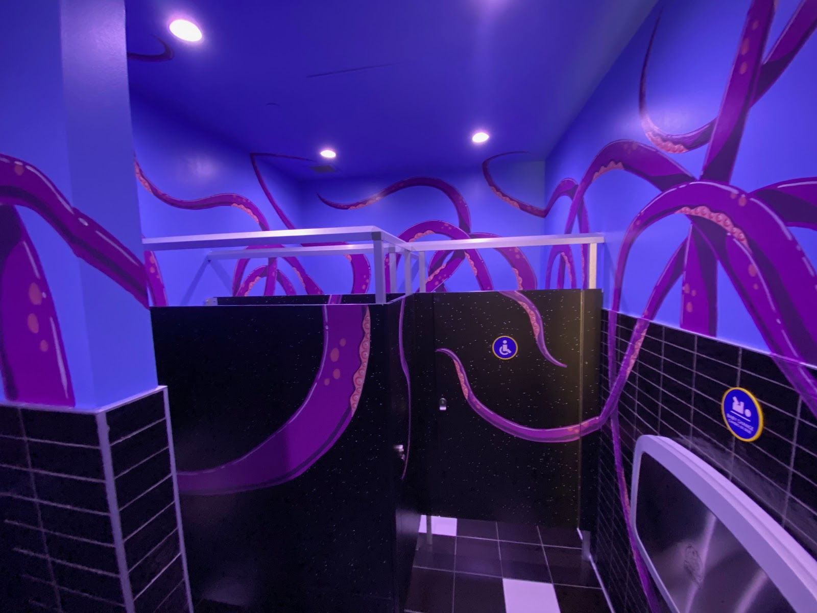 Tentacles across the walls and bathroom stalls inside Omega Mart