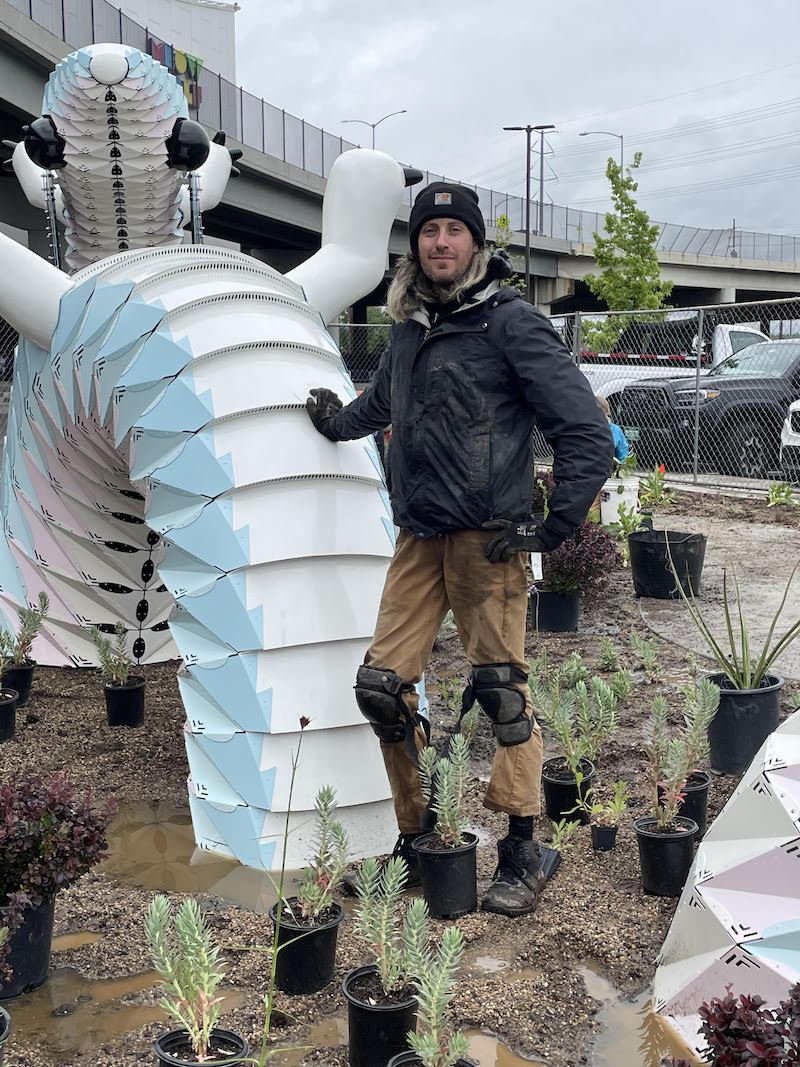 Denver Botanic Garden’s Assistant Curator Kevin Williams standing outside of Convergence Station in the garden next to the Plethodon.