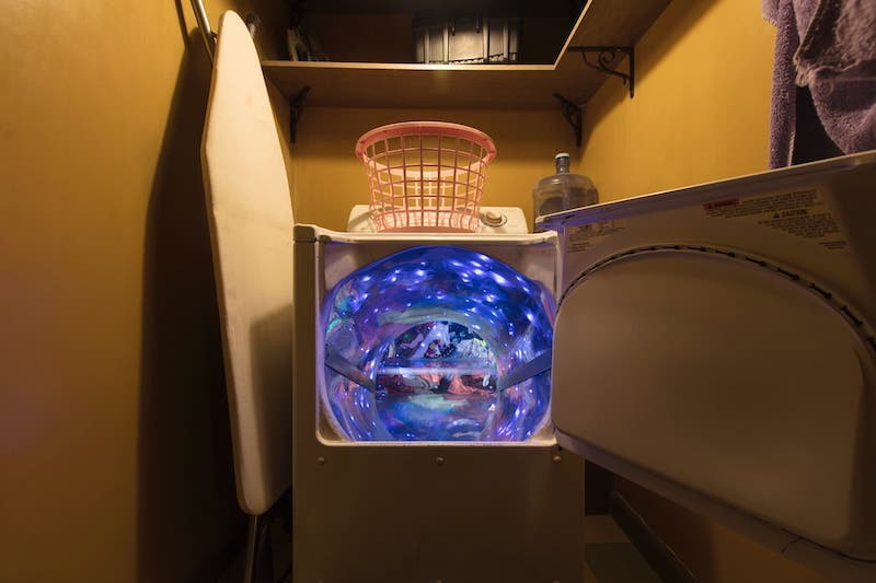 The glowing dryer portal installation at Meow Wolf’s House of Eternal Return