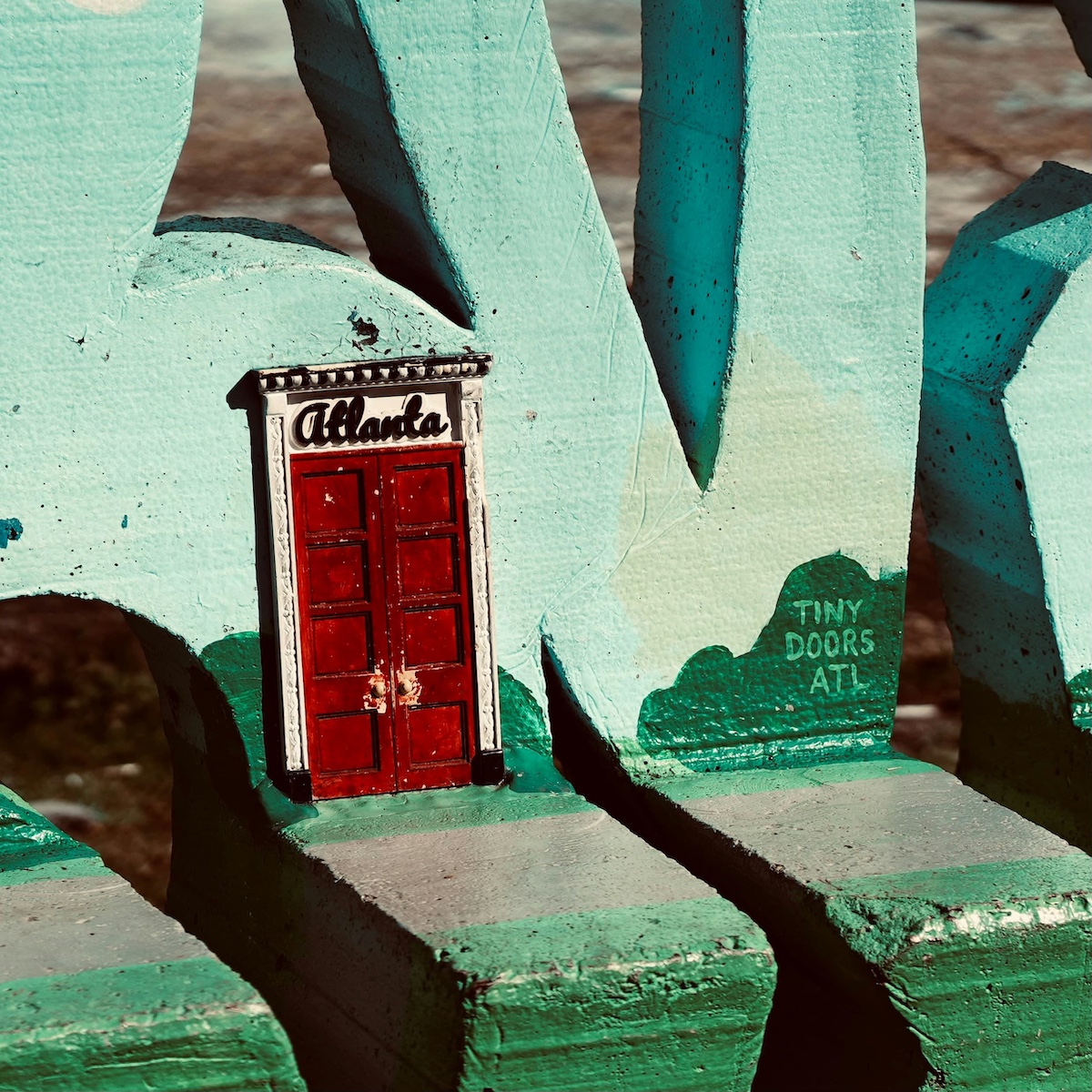 tiny door painted into a wall in Atlanta